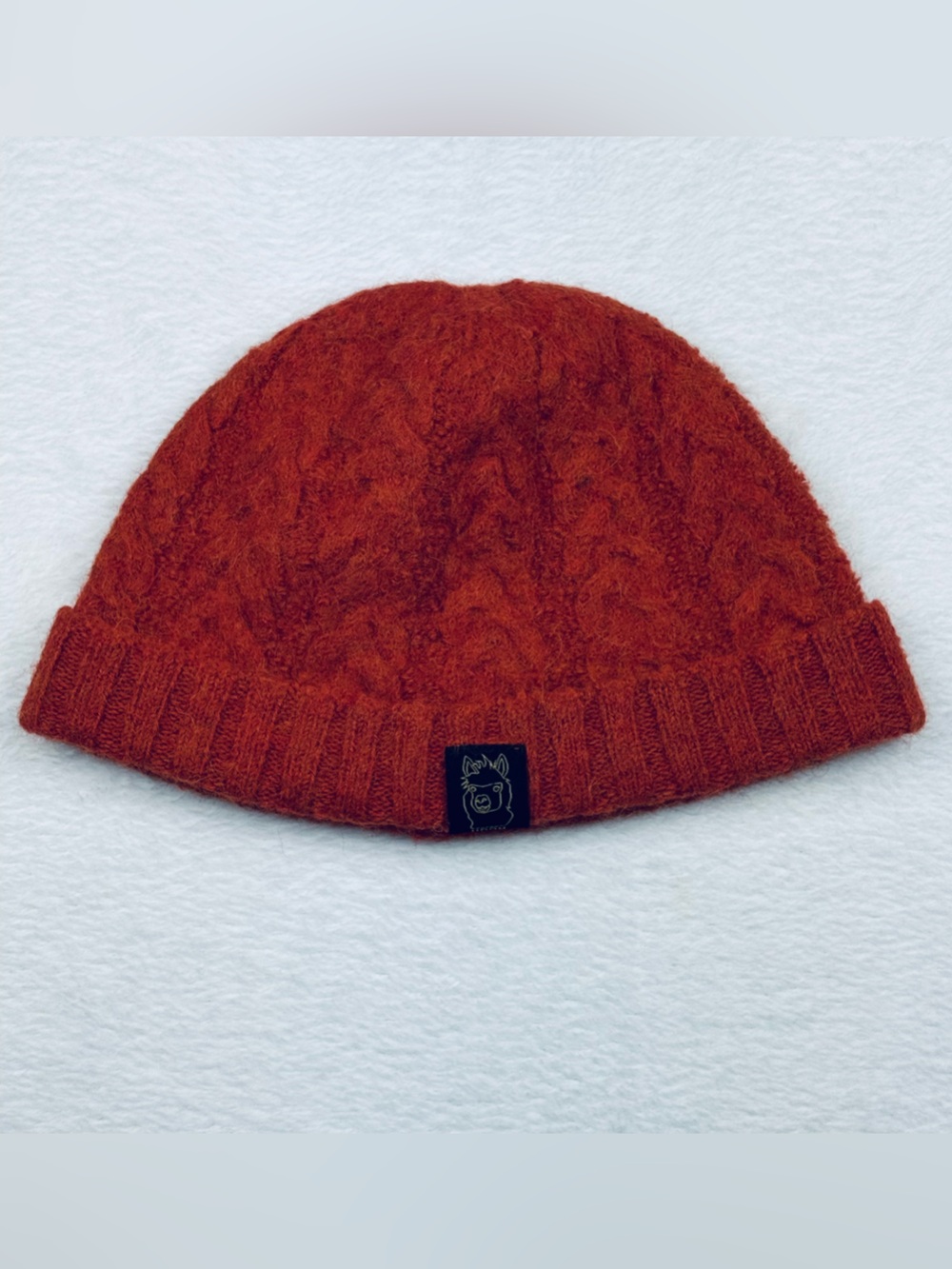 UDOM cable knit beanie. 100% baby alpaca. Burnt orange/ rust color.